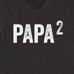 May include: Black t-shirt with white text that reads "PAPA 2".
