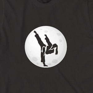 Taekwondo Girl In The Moon Shirt, Christmas Gift, Birthday Gift, Taekwondo Player, The Kick T-Shirt, Karate Fighter, MMA - ID: 1611