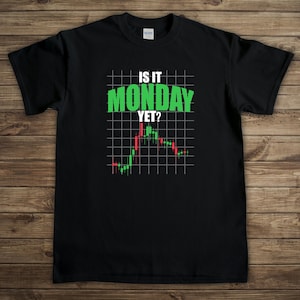 May include: Black t-shirt with a white and green graphic that says "Is it Monday Yet?" with a stock market chart underneath.