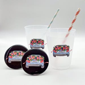 May include: The image features two clear plastic cups and two coasters, each adorned with a blue car graphic overflowing with flowers. The car has a "DIVORCED" license plate. Two striped straws are in the cups.