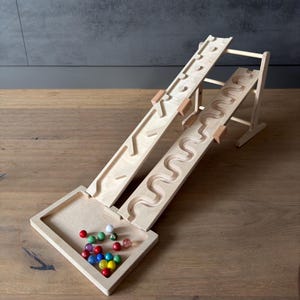 2-track combination marble run set, 2 slalom plates and 2 obstacle plates including race tower and catch tray. Wooden marble run toy.