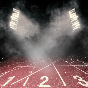 May include: A red running track with white lines and numbers 1, 2, and 3. The track is lit by two spotlights, creating a dramatic effect.