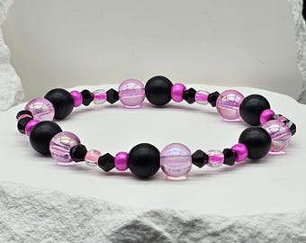 Roze en zwarte stretcharmband met kristallen kralen | 7 inch glaskralenarmband