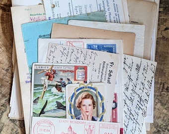 May include: A pile of vintage ephemera, including postcards, stamps, and handwritten letters. The collection features aged paper tones and red postage marks. Some items have text, and the overall aesthetic is nostalgic.