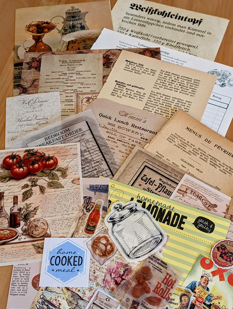 May include: A collection of vintage paper ephemera with a variety of designs and text. The papers include a menu for a restaurant, a recipe for a German dish, and a vintage advertisement for lemonade. The papers are arranged in a random order on a wooden surface.