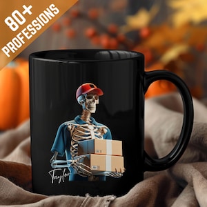 May include: Black ceramic mug featuring a skeleton in a delivery uniform, wearing a red cap, holding two cardboard boxes. The mug has the text "80+ PROFESSIONS" and a signature. A fun, spooky design for Halloween or a unique gift.
