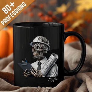 May include: Black ceramic mug featuring a skeleton in a hard hat and gears, holding blueprints and a clipboard. The mug has the text "80+ PROFESSIONS" and the name "Taylor". The design is detailed and artistic.