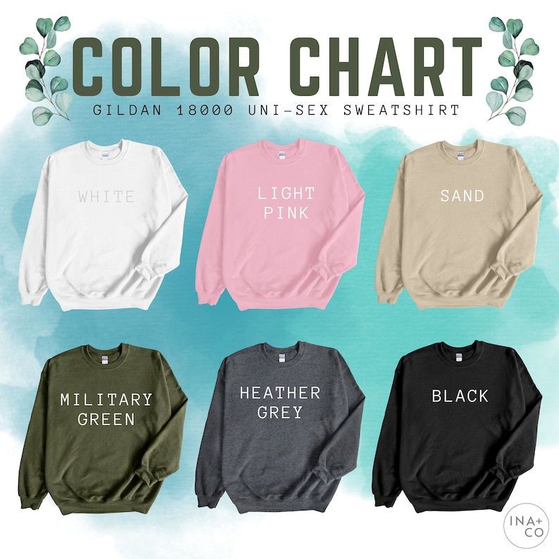 May include: Color chart for Gildan 18000 unisex sweatshirts. The chart shows the sweatshirts in the following colors: white, light pink, sand, military green, heather grey, and black.