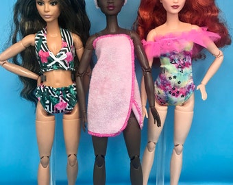 5pc dolls beachwear. 2 dolls swimsuits/Bikini 1 dolls towels 1 dolls headbands and a pair of dolls shoes summer suits for dolls