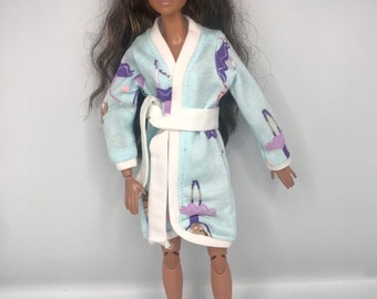 Light blue Dolls dressing gown /robe with ballerina on it . Will fit a curvy doll as well. Dolls  bathrobe