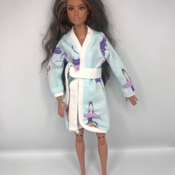 Light blue Dolls dressing gown /robe with ballerina on it . Will fit a curvy doll as well. Dolls  bathrobe