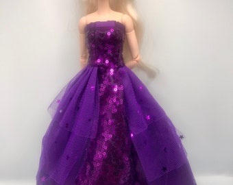 Beautiful purple sparkly sequin off the shoulders dress. Stars and moons on dress