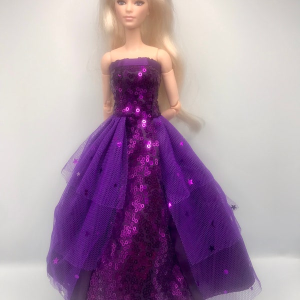 Beautiful purple sparkly sequin off the shoulders dress. Stars and moons on dress