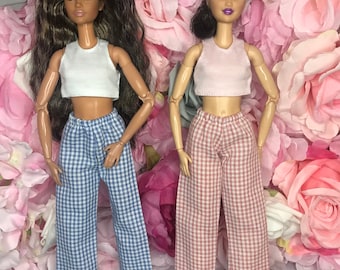 2x Dolls pyjamas dolls pink tank top and checked pink pj bottoms. White tank top and blue check bottoms Sleepwear for dolls dolls nightwear