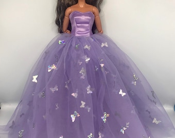 Dolls purple butterfly embellishment butterflies all over it.  Dolls prom dress dolls ballgown dolls fairy outfit