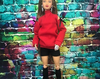 Dolls fashion outfit.Ribbed jumper with cut out shoulders with a ribbon bow. Ribbed shorts socks and ankle boots NOTE jewellery not included