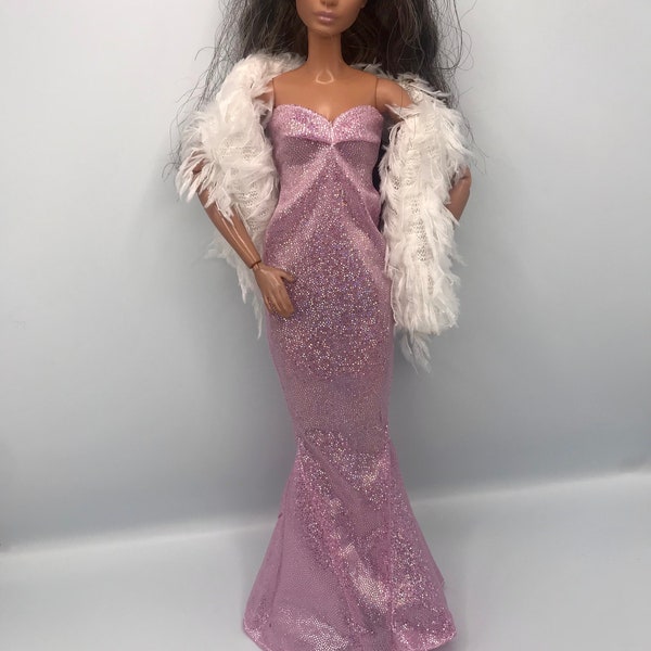 Dolls sparkly glittery pink fishtail dress. Disco dress off one shoulder dress with white feather scarf and Diamonte shoes