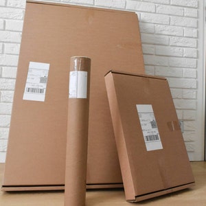May include: Three brown cardboard boxes, one is a tube, and two are rectangular. The boxes are all sealed with tape and have shipping labels on them.
