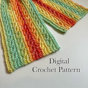May include: A colourful crochet scarf with stripes of green, yellow, orange, and red. The scarf is made with a textured stitch and has a fringe on the ends. Digital Crochet Pattern.