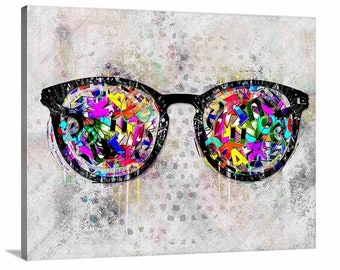 May include: A pair of black framed eyeglasses with colorful letters and numbers inside the lenses. The glasses are set against a white and gray textured background.