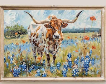 May include: A framed painting of a longhorn steer in a field of bluebonnets and orange flowers. The steer has brown and white markings and large horns. The artwork is signed and has the text "Summer Park Studio".