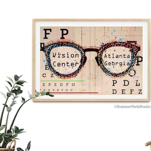 May include: A vintage-style eye chart with a pair of eyeglasses superimposed on it. The eyeglasses are made of a colorful, abstract design. The text on the eye chart reads "Vision Center" and "Atlanta Georgia".