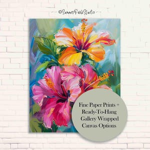 May include: An oil painting of vibrant hibiscus flowers in shades of orange, yellow, and pink, with green leaves against a blue background. The artwork is displayed on a white brick wall. Text on the image reads "Fine Paper Prints + Ready-To-Hang Gallery Wrapped Canvas Options."