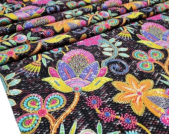 May include: Black fabric with a colorful floral pattern. The flowers are embroidered with sequins and beads in shades of pink, yellow, blue, green, and orange.