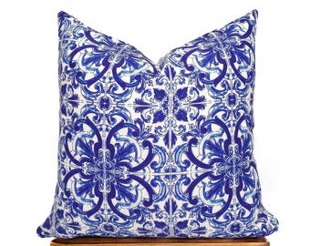 May include: Blue and white patterned throw pillow with a geometric design. The pillow is made of a soft, comfortable fabric and is perfect for adding a touch of style to any room.