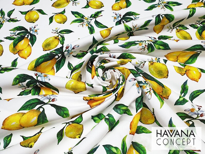 May include: White fabric with a repeating pattern of yellow lemons and green leaves. The fabric has the text "HAVANA CONCEPT" printed in the bottom right corner.