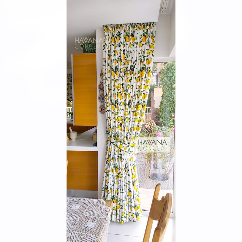 May include: White curtains with a lemon print hang in a window. The curtains are tied back with a white ribbon. The text "HAVANA CONCEPT" is visible on the curtains.