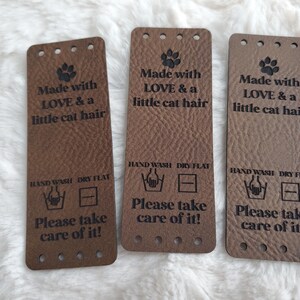 Fun large tags -Made with Love & a little dog/cat hair - Please take care of it - sets of 5 - 3" x 1.1" with sew holes