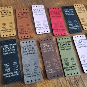 Fun large tags -Made with Love & lots of very bad words -2 bottom choices - sold in sets of 5 - 3" x 1.1" with sew holes