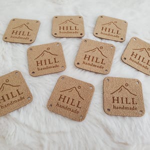 Vegan leather labels 1" x 1" or 1.25” x 1.25” square- round corners - 4 holes - or no holes-custom tags for knit or crocheted items-branding
