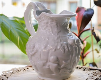 Vintage white porcelain jug Ornament of cherubs and grapevine Signed Furstenberg Seit 1747 West Germany