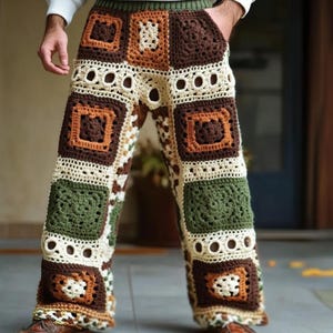 May include: Crocheted pants with a patchwork design in brown, green, and cream colors. The pants have a wide leg and a loose fit.