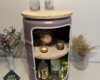 May include: A repurposed metal barrel side table painted in a dusty purple hue, featuring a light wood circular top and a matching interior shelf. The front opening is trimmed in white, and the text RAL 4009 is visible in the upper right corner.
