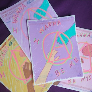 May include: Three colourful postcards with a hand-drawn design of a hand reaching out to another hand. The postcards have the text "I wanna be me" and "I wanna be myself" on them.