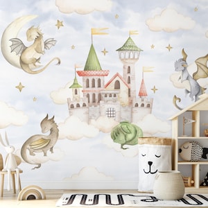 May include: A watercolour mural depicting a fairytale scene with a castle, dragons, clouds, stars, and a crescent moon. The castle has green and red roofs, with yellow flags. Dragons in grey, green, and tan are scattered across a soft blue background.
