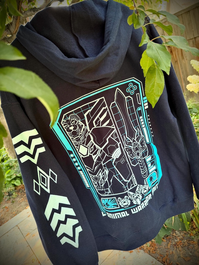 May include: A black hooded sweatshirt featuring a large cyan and white graphic on the back depicting a robotic bear warrior holding a sword. The text ANIMAL WARRIOR is printed at the bottom. The sleeve has a series of light green geometric symbols.