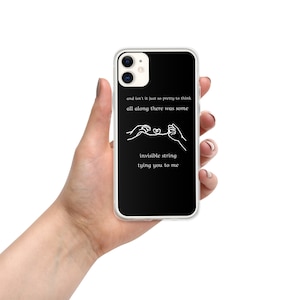 May include: Black phone case with a white design of two hands holding an invisible string tied together with a heart. The text on the case reads "and isn't it just so pretty to think all along there was some invisible string tying you to me."