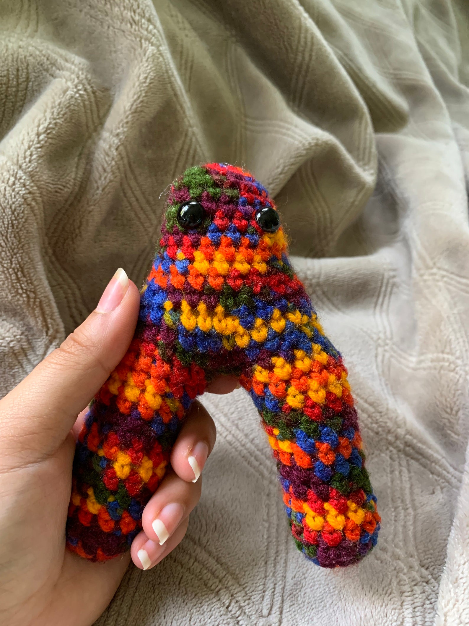 Rainbow patterned crochet cryptid | Etsy