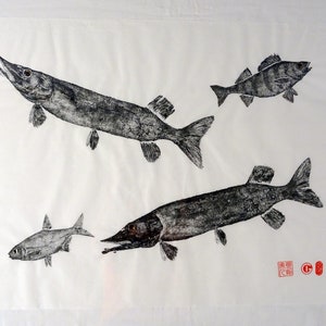 May include: A monochrome print featuring various fish on a white backdrop. The fish are rendered in a detailed, artistic manner, showcasing different sizes and forms. The print has a traditional, possibly Asian, aesthetic.
