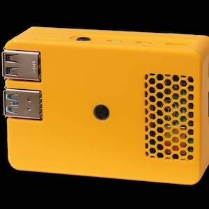 May include: A yellow plastic case with a honeycomb-shaped vent and two USB ports. The case is designed to fit a Raspberry Pi computer.