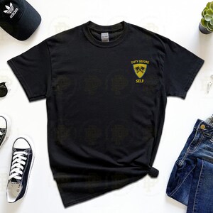 May include: Black t-shirt with a yellow graphic that says "Duty Before Self" and features two crossed axes.