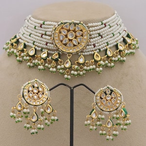 Trendy Kundan Choker Necklace Earrings with Pearls, perfect for traditional weddings. Inspired by Sabyasachi, this jewelry set adds a touch of elegance. ISMI CREATIONS, artificial jewelry.