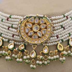 Trendy Kundan Choker Necklace Earrings with Pearls, perfect for traditional weddings. Inspired by Sabyasachi, this jewelry set adds a touch of elegance. ISMI CREATIONS, artificial jewelry.