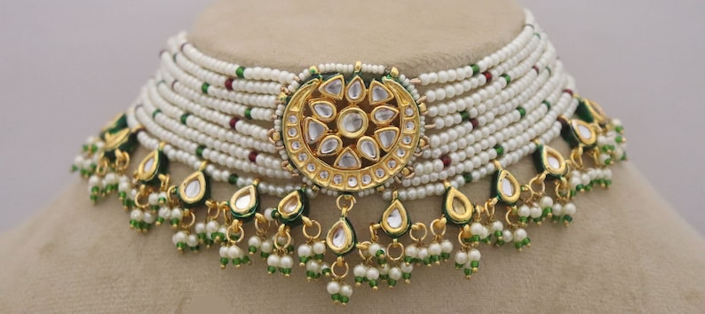 Trendy Kundan Choker Necklace Earrings with Pearls, perfect for traditional weddings. Inspired by Sabyasachi, this jewelry set adds a touch of elegance. ISMI CREATIONS, artificial jewelry.