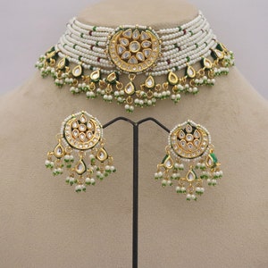 Trendy Kundan Choker Necklace Earrings with Pearls, perfect for traditional weddings. Inspired by Sabyasachi, this jewelry set adds a touch of elegance. ISMI CREATIONS, artificial jewelry.