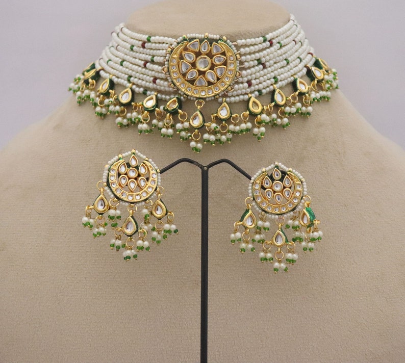 Trendy Kundan Choker Necklace Earrings with Pearls, perfect for traditional weddings. Inspired by Sabyasachi, this jewelry set adds a touch of elegance. ISMI CREATIONS, artificial jewelry.